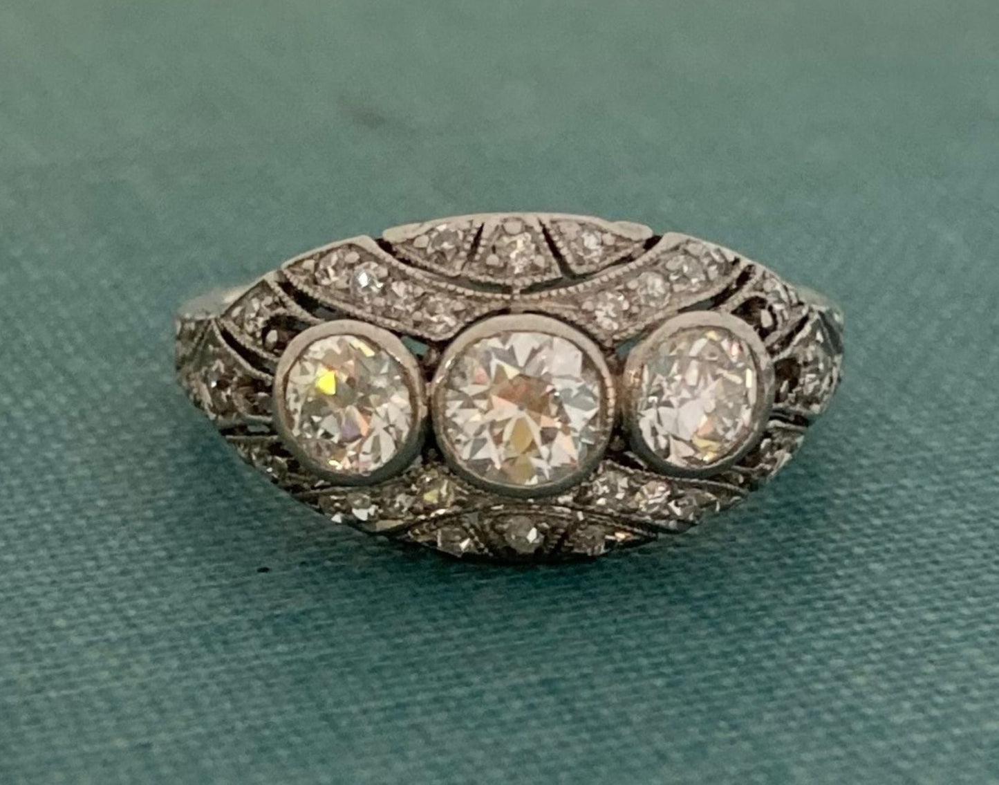 Three Stone Platinum Dome Ring